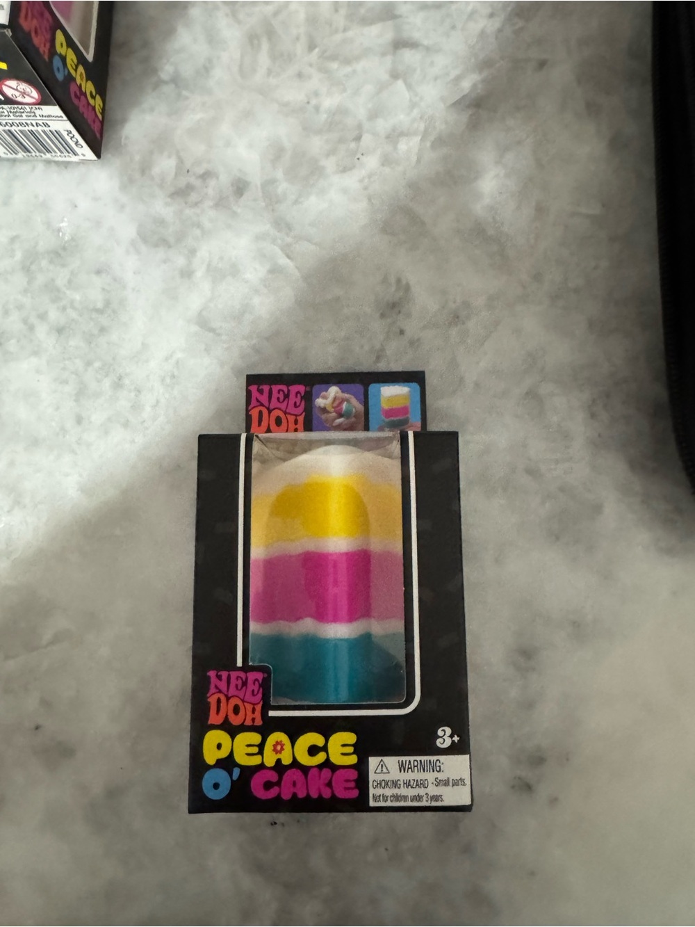 Nee Doh Peace O' Cake Squeeze Toy - White, Yellow, Pink, Blue - Picture 2 of 6